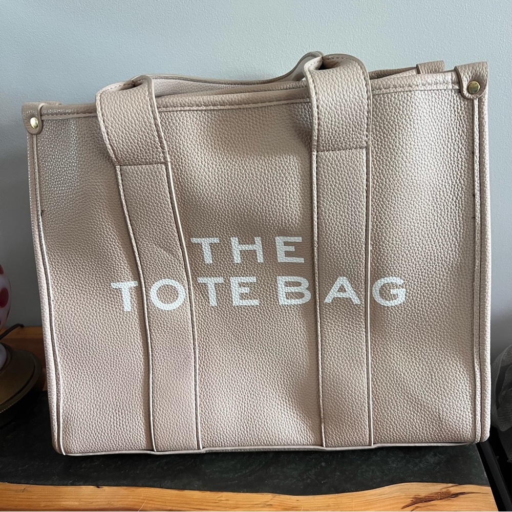 The tote bag. Tan. Purse.